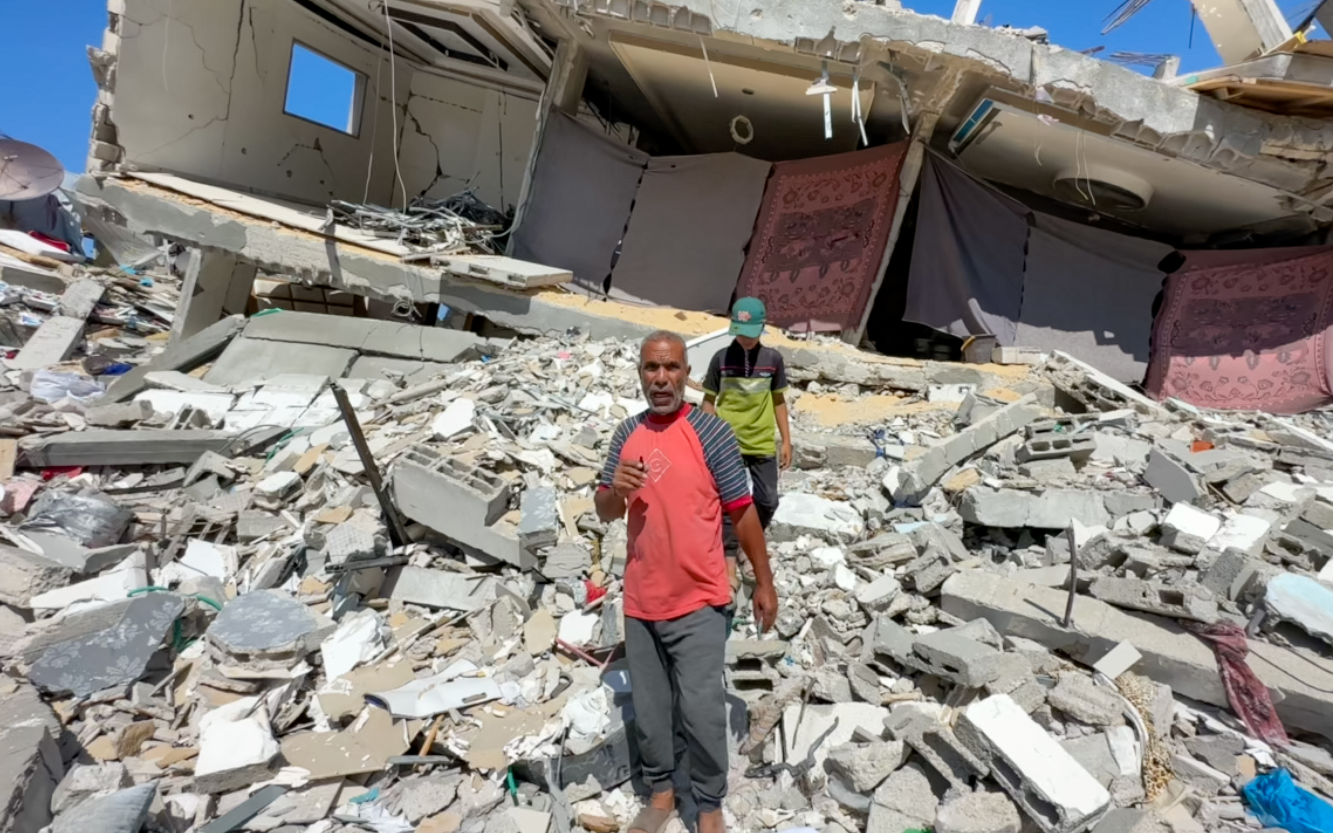 Ismail Abu Madi has hung sheets to try to close off what’s left of his house